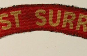 EAST SURREY WW2 Printed Shoulder Title Badge - CALICO PRINTERS  ---  Lot No. 6291