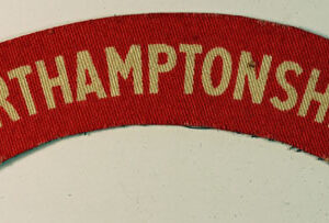 NORTHAMPTONSHIRE WW2 Printed Shoulder Title Badge - CALICO PRINTERS  ---  Lot No. 6450