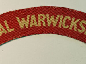 ROYAL WARWICKSHIRE WW2 Printed Shoulder Title Badge - CALICO PRINTERS  ---  Lot No. 6402