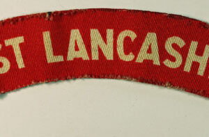 EAST LANCASHIRE WW2 Printed Shoulder Title Badge - CALICO PRINTERS  ---  Lot No. 6541