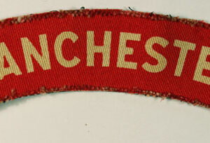 MANCHESTER Regiment WW2 Printed Shoulder Title Badge - CALICO PRINTERS ---  Lot No. 6546