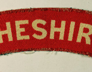 CHESHIRE WW2 Printed Shoulder Title Badge - CALICO PRINTERS ---  Lot No. 6642