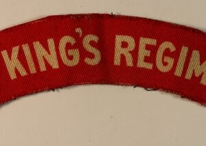 THE KING'S REGIMENT WW2 Printed Shoulder Title Badge - CALICO PRINTERS  ---  Lot No. 6808