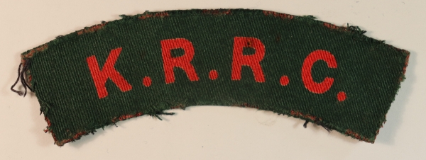 K.R.R.C. – KING’S ROYAL RIFLE CORPS WW2 Printed Shoulder Title Badge – CALICO PRINTERS — Lot No. 6837
