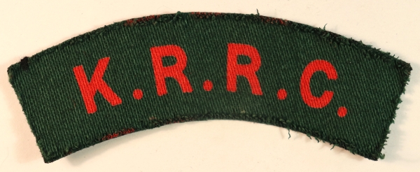 K.R.R.C. – KING’S ROYAL RIFLE CORPS WW2 Printed Shoulder Title Badge – CALICO PRINTERS — Lot No. 6988