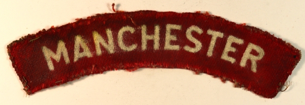 MANCHESTER Regiment WW2 Printed Shoulder Title Badge – CALICO PRINTERS — Lot No. 6990