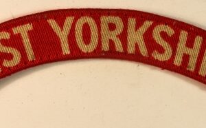 WEST YORKSHIRE WW2 Printed Shoulder Title Badge - CALICO PRINTERS  ---  Lot No. 7010