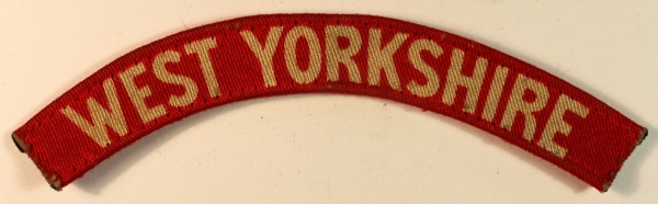 WEST YORKSHIRE WW2 Printed Shoulder Title Badge – CALICO PRINTERS — Lot No. 7010